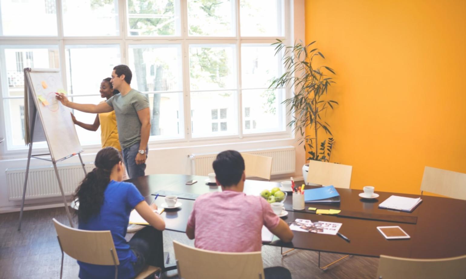 Students engaged in collaborative financial planning workshop